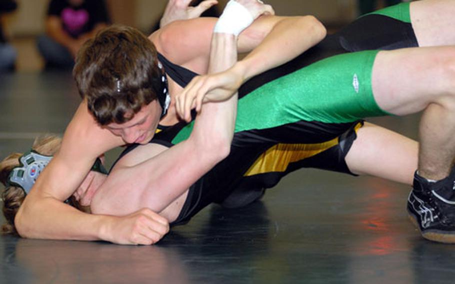 Kadena Panthers 129-pounder Chris Hoshaw gains the advantage over Daniel Sly of the Kubasaki Dragons during Thursday&#39;s Okinawa Activities Council dual meet at the Dragons&#39; Den, Kubasaki High School, Camp Foster, Okinawa. Hoshaw pinned Sly in 3 minutes, 34 seconds, but Kubasaki won the dual meet 41-23, its second straight win over Kadena after losing its previous nine, and clinched the season series from the Panthers 2-0 for the first time since 2002-03.