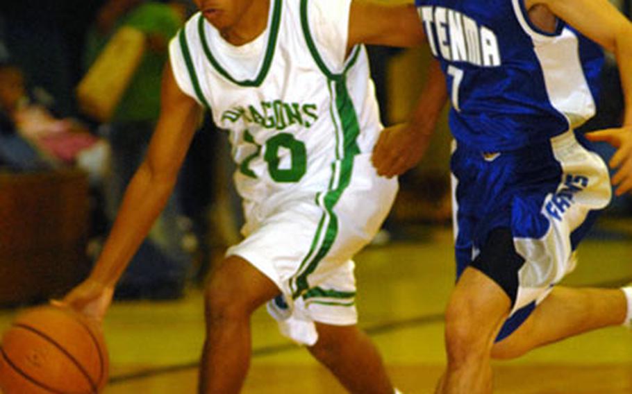 Kubasaki Dragons guard Mike Rogers (10) dribbles past a Futenma High School defender during Friday's pool-play games in the 1st annual Okinawa-American Shootout for high school basketball teams at the Panther Pit, Kadena High School, Kadena Air Base, Okinawa. Kubasaki won 43-38.