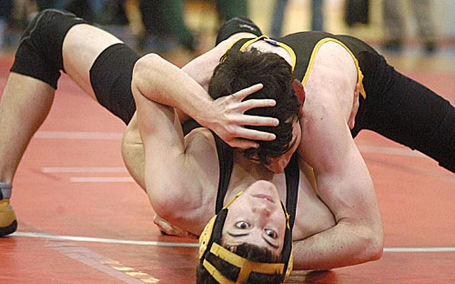 Vicenza&#39;s Shane Hinton tries to pin Patch&#39;s Chris Oppliger in the 140-pound championship match Saturday in the sectional wrestling tournament at Aviano Air Base, Italy. Hinton won the title with a pin in the first round.