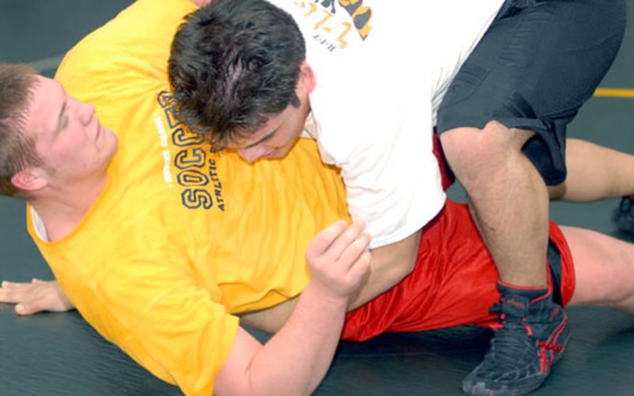 Edgren senior heavyweights Niels Johnson (left) and David Leh work on moves during a recent practice. The Eagles return a defending champion in Kevin McDonald (168) and a veteran core including Leh, Johnson and junior 180-pounder Andrew Blankenship, giving the team hope of a top-four finish in the Far East wrestling tournament this week.