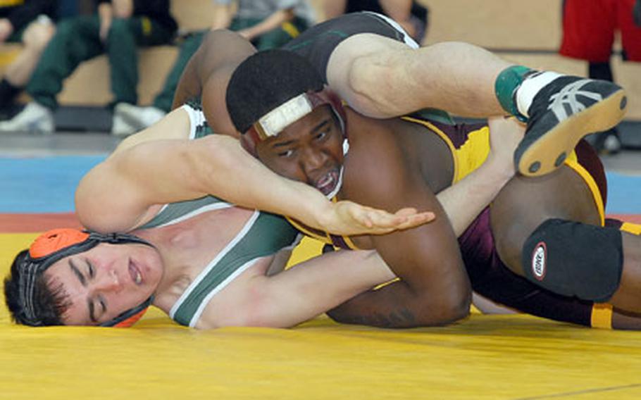 Luis Trujillo of Alconbury, left, and Vilseck&#39;s Demario Galbreath grapple in a 171-pound match at the DODDS-Europe wrestling finals in Wiesbaden, Germany, on Friday. Galbreath won the match.