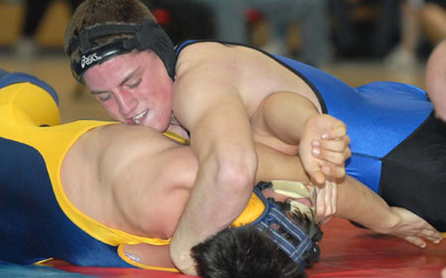 Eric Vandal of Hohenfels, top, pins Steven Ponte of Wiesbaden to win the DODDS-Europe 160-pound wrestling title.