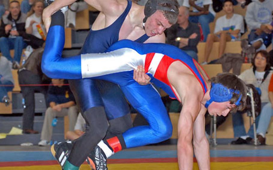 Aviano&#39;s Gary Vogt, left, beat Ramstein&#39;s Trey Fortunator to win the DODDS-Europe 135-pound wrestling title.