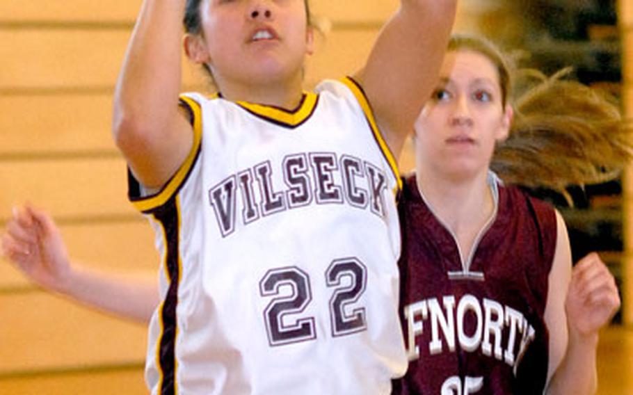 Cathy DelaRosa of Vilseck gets a shot off in front of AFNORTH&#39;s Sarah Roberts in Vilseck&#39;s 39-7 win in opening day Division II action at the DODDS-Europe basketball finals in Mannheim on Wednesday.