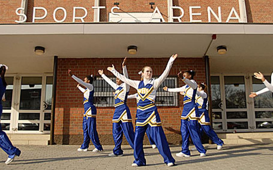 Wiesbaden Warriors cheerleaders practice their halftime show outside of the Sports Arena on the second day of DODDS-Europe’s high school basketball championships Thursday at Mannheim. A cheerleading competition is scheduled to kickoff Saturday morning.