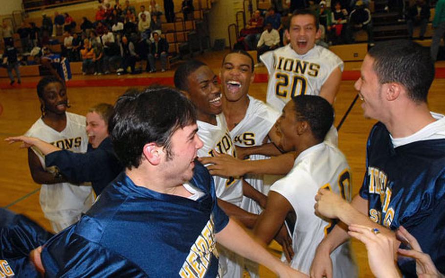 The Heidelberg Lions celebrate their Division I boys basketball title after beating Ramstein 43-40.