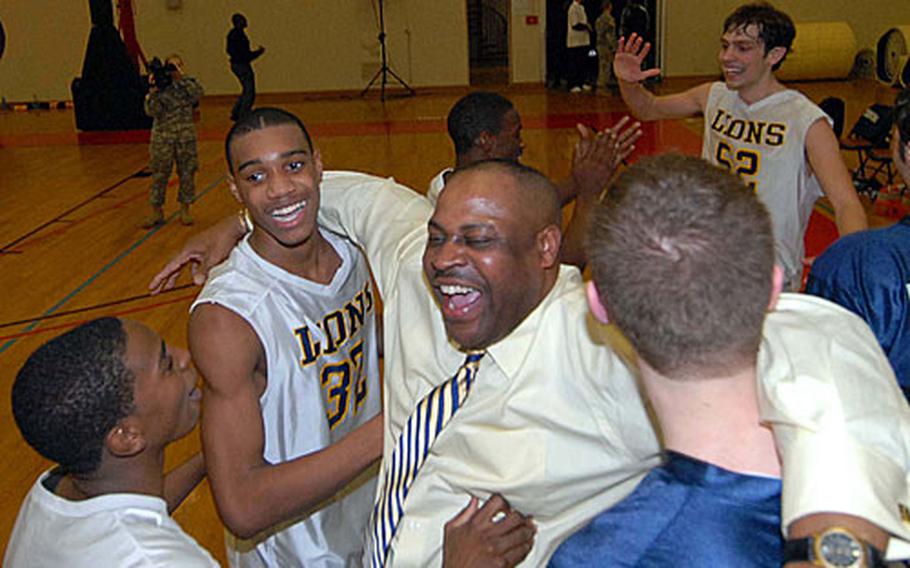 Heidelberg volunteer coach Claude Wesley celebrates with his players. Wesley took over the Lions from suspended coach Brad Shahan and guided them to eight straight season-ending victories and the title.