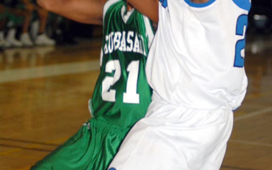 Kubasaki Dragons’ Quinton Mason, #21, has his path blocked by Seoul American’s Joe McLean.