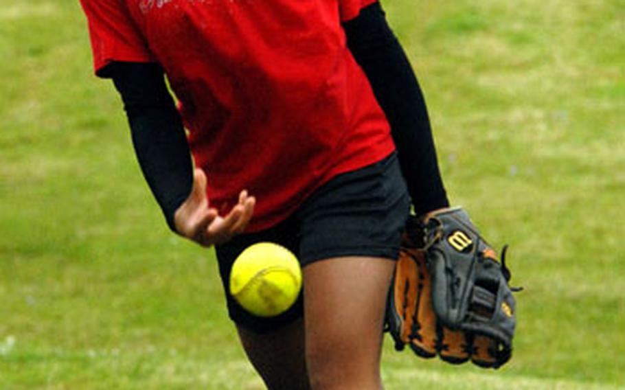 Kubasaki sophomore right-hander Michelle Acosta winds up and delivers during pitchers&#39; workouts behind Kubasaki High School on Camp Foster, Okinawa.