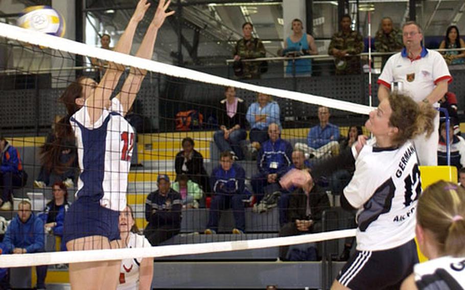 Alice Bartek attempts a block against the German air force during the final match of the 3rd Annual Air Component Command Headquaters Ramstein volleyball tournament Wednesday at Ramstein Air Base, Germany.
