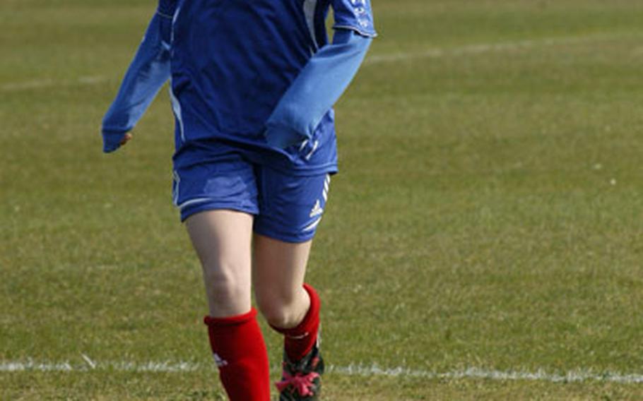 Ramstein winger Bridgette Dean dribbles up the field Saturday on a windy day at RAF Lakenheath. Dean assisted on the second goal of the game, setting up Stephanie Silvey on a nice cross, during Ramstein&#39;s 3-0 win.