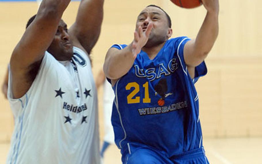 Wiesbaden&#39;s Donald Craig, right, goes to the basket against Heidelberg&#39;s Harry Davis at the 2007 Army-Air Force Final Four in Wiesbaden, Germany, on Sunday night. Wiesbaden needed an if-necessary game to take the title in an all-Army final, defeating Heidelberg 69-56.