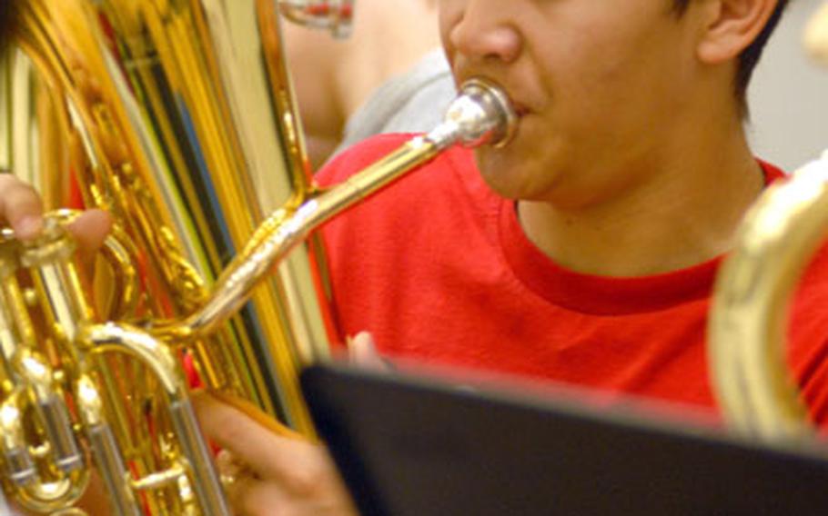 Taegu American junior baritoner/baseball player Andrew Davenport plays during Monday&#39;s rehearsal for Friday&#39;s honors band concert, the culminating event of this week&#39;s DODDS-Pacific Far East High School Music Festival. Davenport will miss this weekend&#39;s DODDS-Korea baseball triangular at Camp Humphreys because of the concert.