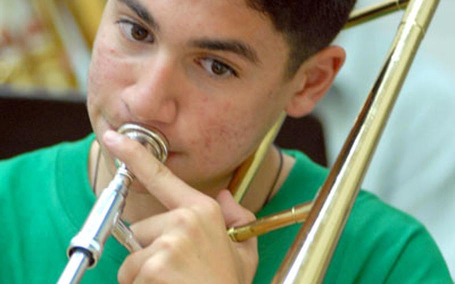 Sophomore Andrew Quallio of Japan&#39;s Zama American High School plays the trombone on Percy Granger&#39;s "Finale From Lincolnshire Posy (the Lost Lady Found)" in rehearsal Tuesday at Camp Foster.