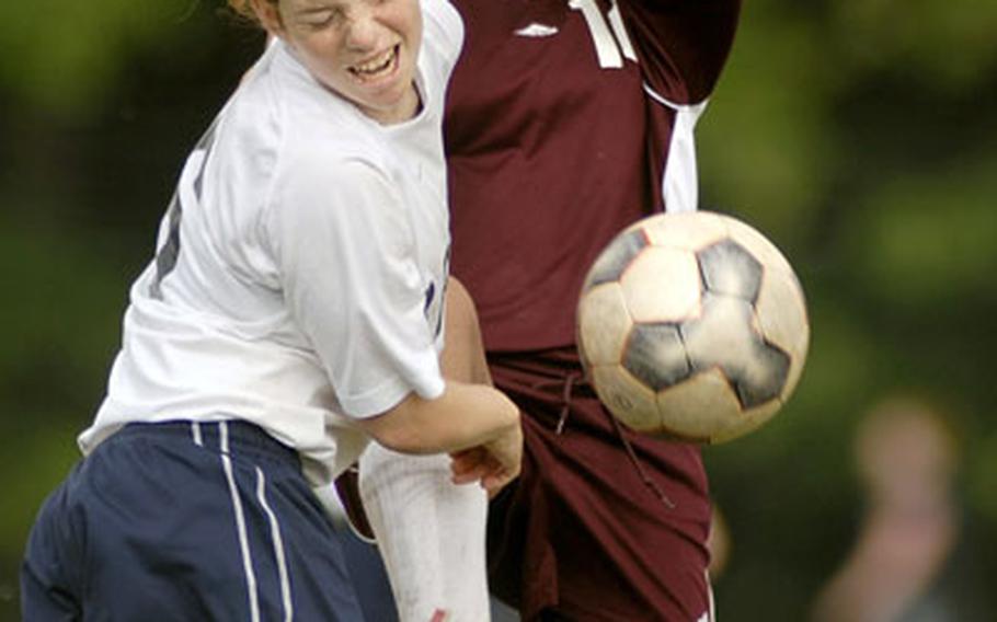 Alyssa Krause, a sophomore from Black Forest Academy, front, and Leah Beilhart of Vilseck collide during the the title game of the DODDS-Europe Division II girls soccer tournament Saturday at Ramstein.