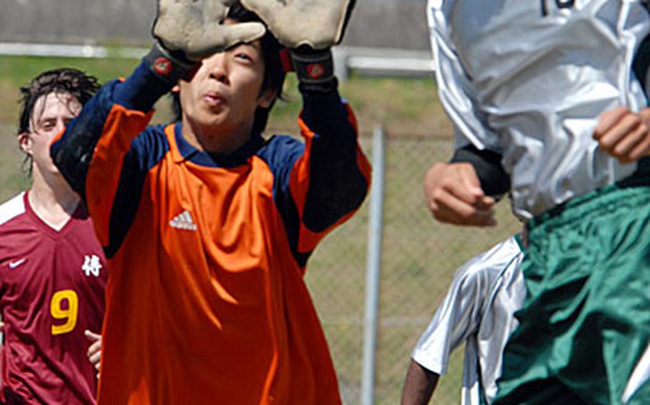 Taegu American Warriors goalkeeper Paul Koo and fullback Daniel Garcia try to defend a corner kick during Monday&#39;s pool play in the 2007 Far East High School Boys Class A (small schools) Soccer Tournament at Penny Lake Field 1, Iwakuni Marine Corps Air Station, Japan.