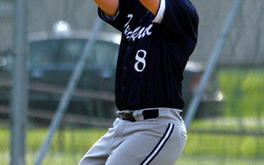 All-Armed Forces shortstop Denver Edick of Iwakuni catches a popup against Los Guzzleros open team during Sunday&#39;s game.