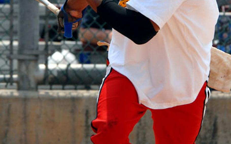 Lynell "Nelly" McLeod watches the first of his two in-park home runs sail to the fence against Los Guzzleros during Monday&#39;s men&#39;s championship. McLeod, a civilian at MacDill Air Force Base, Fla., went 4-for-4 with two doubles and three RBIs.