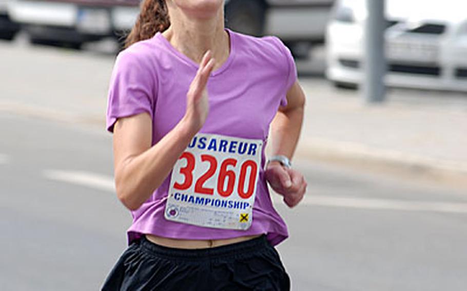 The top female runner in the IMCOM-Europe U.S. Forces 10-Miler, Army Capt. Stephanie Feagin, finishes strongly at.