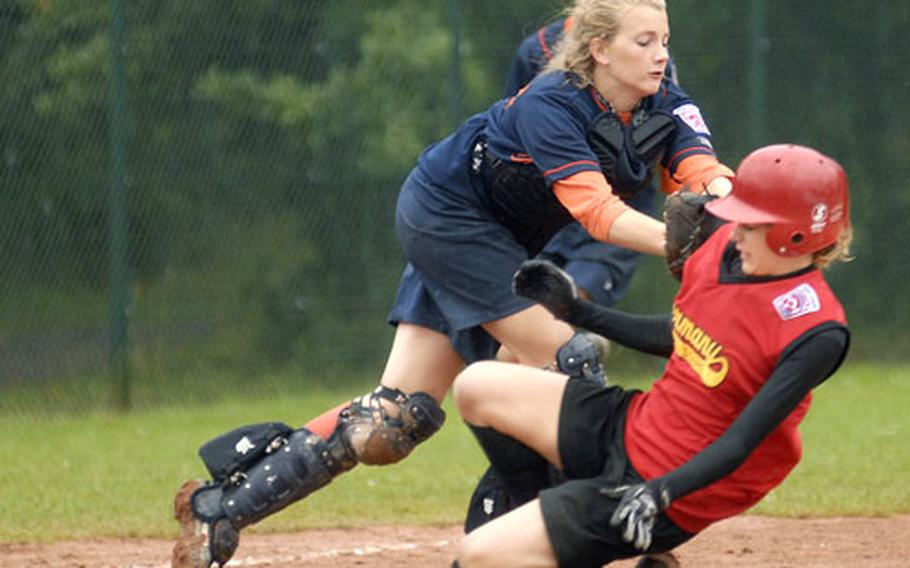 Floor Hoogland of the Netherlands team tags out Natasha Fleming, 15, an American military dependent on the German team, during the Seniors League softball championship game Sunday at Ramstein. The Netherlands beat the German team 5-1.