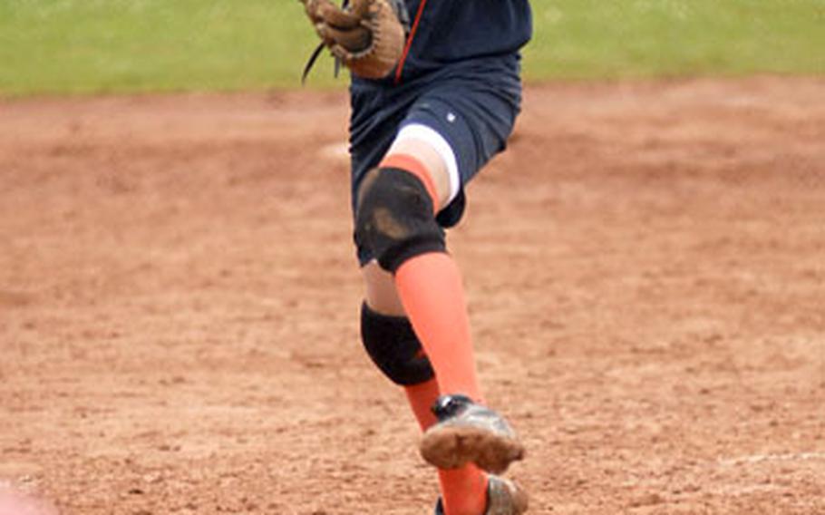 Marjolein Merkx, 14, of the Netherlands team, delivers a pitch during the final inning of the Seniors League softball championship game.