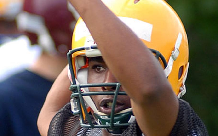 Prospective SHAPE quarterback Alton Steele looks for a receiver during a receivers&#39; drill.