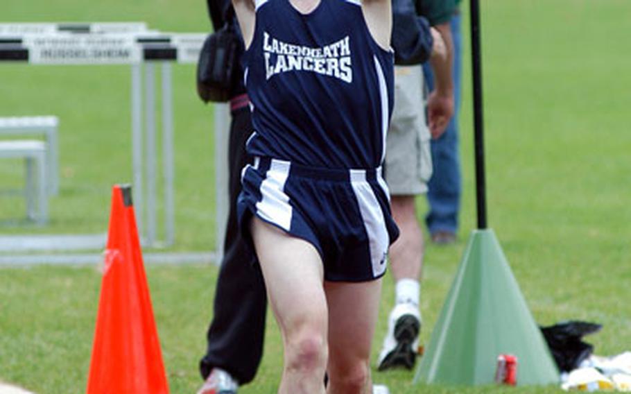 Lakenheath senior Greg Billington celebrates his record-setting victory in the men&#39;s 3,000-meter race Friday at the 2007 DODDS Europe track and field championships. He finished 12th in the junior men’s division of the International Triathlon Union’s World Championships in Hamburg, Germany.