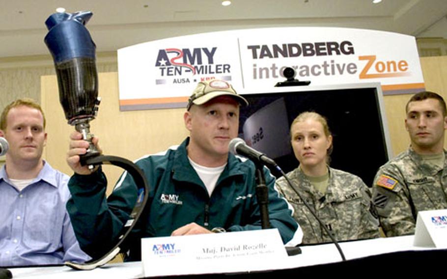 At a Friday press conference in Arlington, Va., Maj. David Rozelle, captain of the Missing Parts in Action team, displays the prosthetic leg he uses for running in races like Sunday&#39;s Army Ten-Miler.