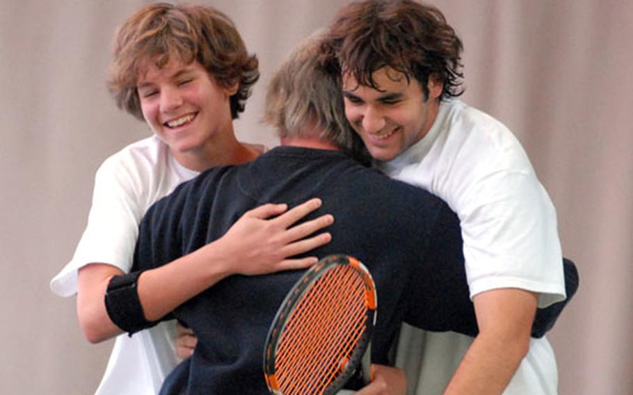 Ramstein&#39;s Clay Marquart, left, and Eric Radvany, right, celebrate their 2007 DODDS-Europe boys&#39; doubles title with their coach Sam Jones, after beating Brady Covington and Shota Morisaka of the International School of Brussels 6-2, 6-4.