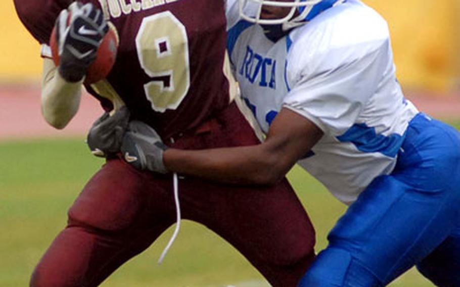 Rota&#39;s Chris Alexander tackles Baumholder&#39;s Artrell Davis.