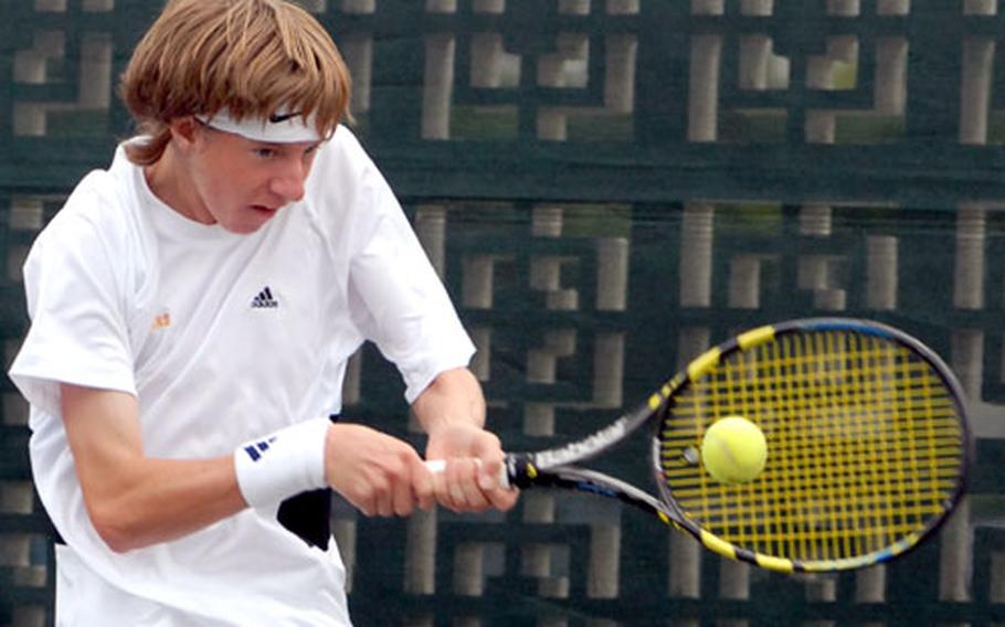 Kadena sophomore Kyle Sprow slaps a backhand return against Kenta Takahashi of Yokota during Wednesday&#39;s boys singles championship in the 2007 Far East High School Tennis Tournament at Kadena Air Base, Okinawa. Sprow outlasted Takahashi 6-2, 3-6, 6-2.