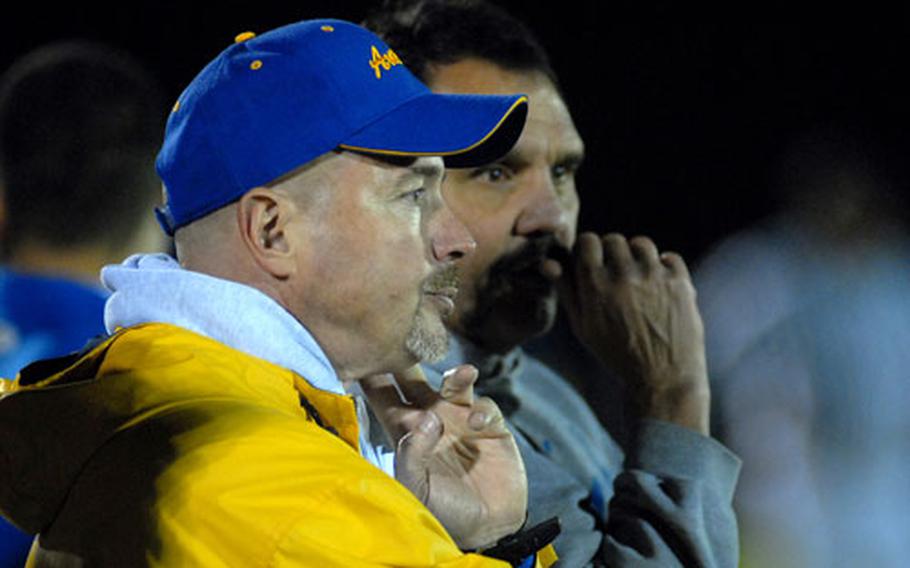 Ansbach head coach Marcus George, left, watches with defensive coordinator Gary Feletar, as the Cougars captured the Division II crown with a 44-8 win over Bitburg on Nov. 3.The European Football Coaches Association voted George the DODDS-Europe coach of the year for the second straight year.