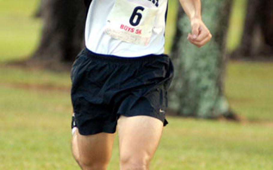 Zama American junior Andrew Quallio heads into the final turn in the 2007 Far East High School Cross-Country Meet. Quallio has been named Stars and Stripes male Athlete of the Quarter.