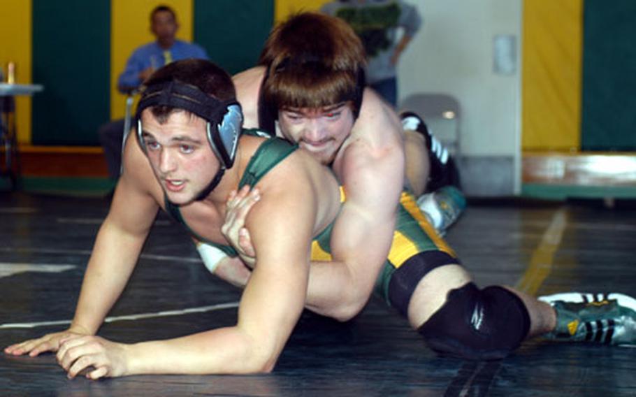 Andrew Blankenship, bottom, of Robert D. Edgren and Daniel Polaski of Zama American go at it in the 180-pound weight class Saturday at the DODDS-Japan wrestling tournament at Robert D. Edgren High School, Misawa Air Base, Japan. Blankenship, a 2006 Far East tournament gold medalist, won the weight class and Polaski took third.