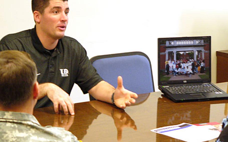 Jason Berna, men’s and women’s soccer coach at the University of Dubuque, outlines his program Tuesday at Heidelberg High School. Berna, Dubuque football coach Vince Brautigam and associate admission director Bob Broshous are scheduled to visit Ansbach on Wednesday and Vilseck and Hohenfels on Thursday.