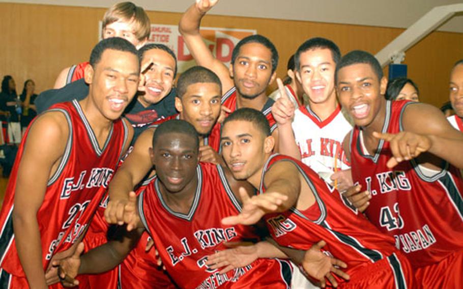 E.J. King Cobras celebrate their victory in Friday's DODDS-Japan Basketball League game at Fleet Gym, Yokosuka Naval Base, Japan. E.J. King beat Nile C. Kinnick 59-57 on a buzzer-beater shot by senior Keith Williams.