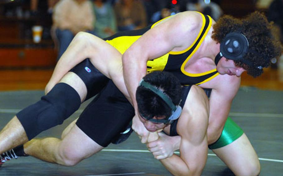 Tyler Broome of Kadena gets the upper hand on Matt Meno of Kubasaki in the 180-pound bout during Thursday&#39;s Okinawa Activities Council wrestling meet at Dragons Den, Kubasaki High School, Camp Foster, Okinawa. Groome pinned Meno in 3 minute, 50 seconds and Kadena won 40-19, snapping the Dragons&#39; three-meet regular-season winning streak against the Panthers.