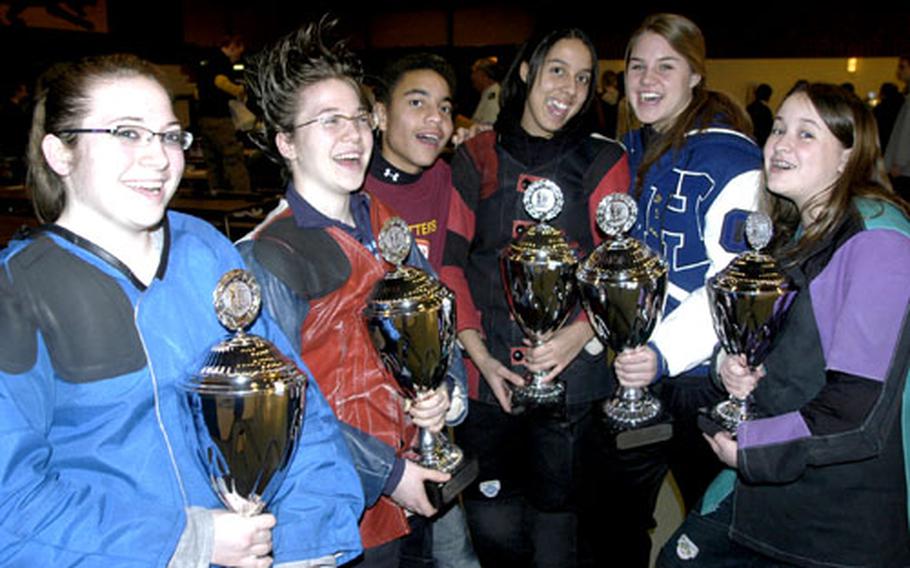 Members of the Hohenfels marksmanship team celebrate with their trophies after defending their USAREUR/DODDS Rifle Championships title on Saturday. From left, they are Emily Adams, Sarah Adams, Andrew Morton, Jessica Walloch, Sunny Petery and Katelyn Bronell.