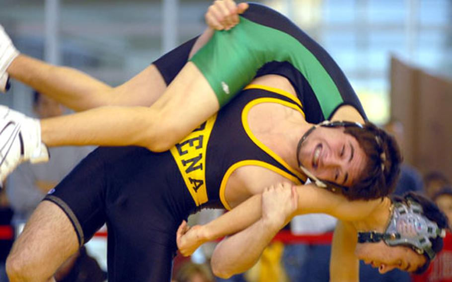 Harry Bloom of the Kadena Panthers uses a fireman&#39;s carry to deposit Chris Paul of the Kubasaki Dragons onto the mat during Saturday&#39;s 141-pound bout in the dual-meet championship of the 2008 DODDS-Pacific Far East High School Wrestling Tournament. Bloom won by superior decision 2-0 (7-0, 7-0) and the Panthers rallied from a 13-4 deficit to beat the Dragons 34-24 for the fourth Far East Wrestling Tournament team title in school history.