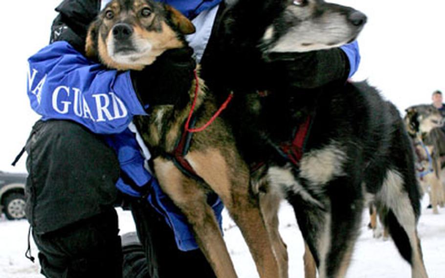 Master Sergeant Rodney Whaley and two of his sled dogs.