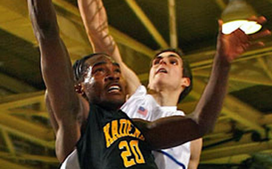 Seoul American senior Shawn Grandy’s block of a shot by Kadena junior Jamil Barney late in the fourth quarter of the Class AA title game on Feb. 23 turned the momentum of the contest and has been chosen as Stars and Stripes’ Play of the Quarter. Seoul American won 64-60.