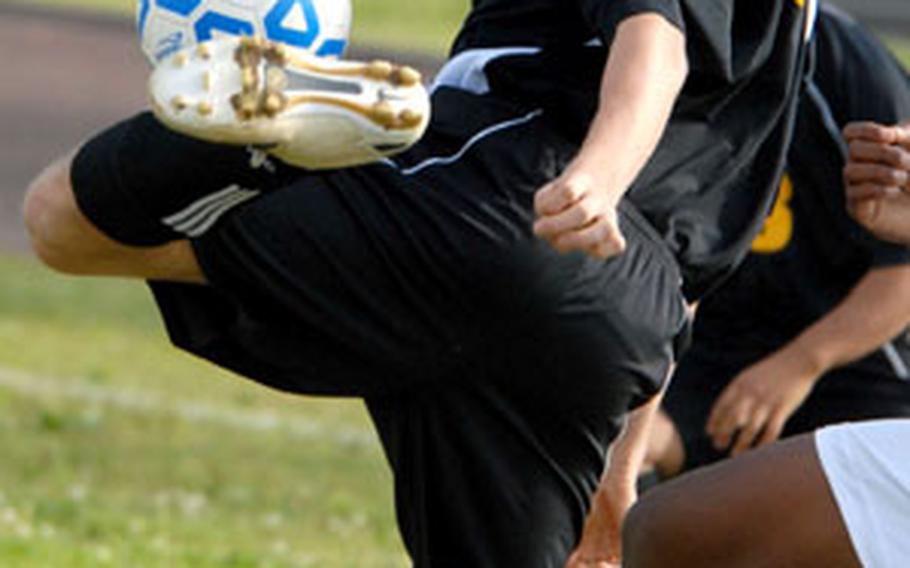 Dillon Bush of the Kadena Panthers appears to balance the ball against his left ankle against the Kubasaki Dragons Friday at Kadena Air Base, Okinawa. Kubasaki edged Kadena, 3-2, leveling the season series 1-1, each game decided by a 3-2 score.