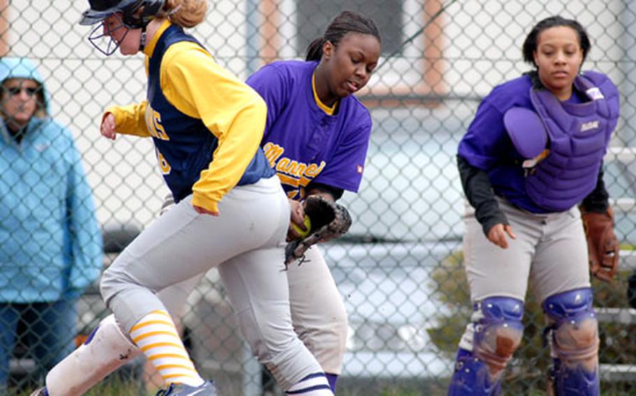 Mannheim pitcher Erica Wilson&#39;s tag is a little late on Heidelberg&#39;s Victoria Jacson in the second game of Saturday&#39;s doubleheader. At right is Mannheim catcher Ayanna Washington.
