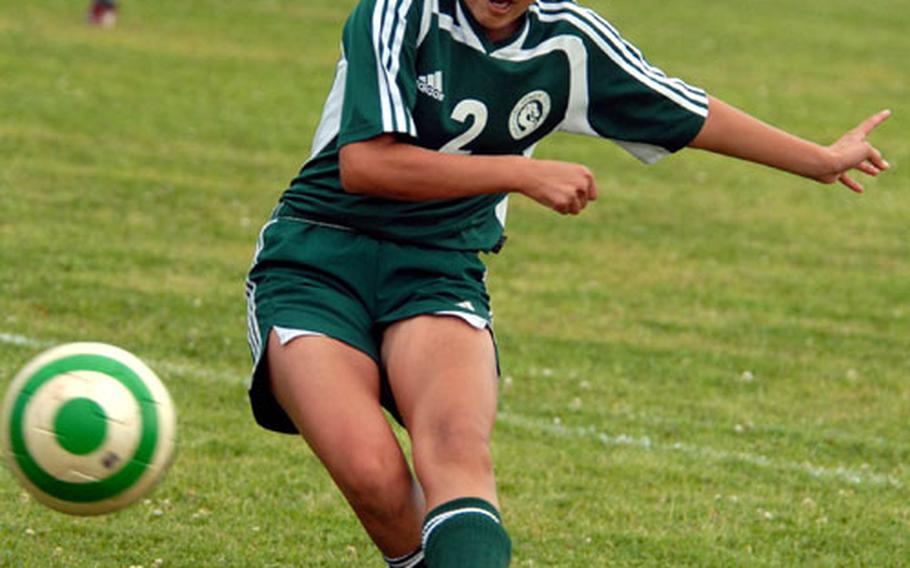 Kubasaki senior center-forward Bridget Ramirez lets fly the second of her two goals against Ryuho, a women’s club team, during Saturday’s match at Camp Foster, Okinawa. Kubasaki edged Ryuho 2-1.