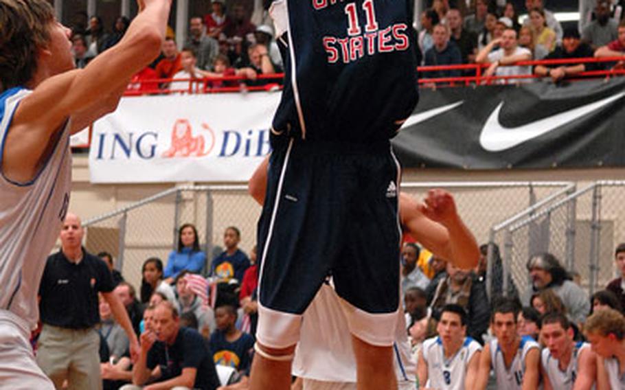 Jeffree Withey of the U.S. shoots a jumper over Israel&#39;s Daniel Rom,.