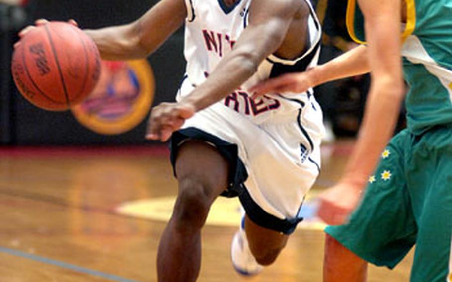 Irving Walker of Team USA drives past Jorden Page of Australia.