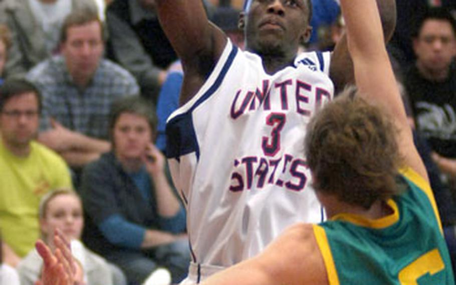 Team USA&#39;s Cashmere Wright of Savannah, Ga., puts up a jumper over Ryan Broekhoff of Australia late in the second half.
