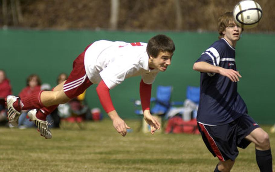 A lunging Niko Gazzale from Kaiserslautern heads in a goal past Christopher King of Bitburg early in the second half Saturday at Kaiserslautern. The goal proved to be the decisive score as Kaiserslautern won, 3-2.