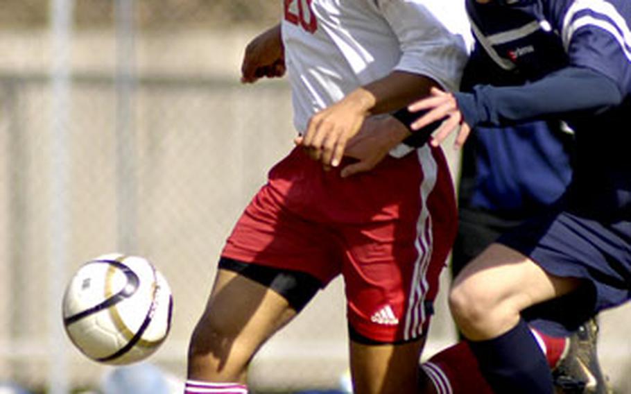 Leroy Porter of Kaiserslautern, left, battles with Marcus Gohl of Bitburg during the first half Saturday at Kaiserslautern.