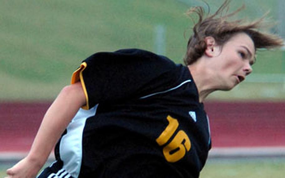Kadena freshman Josh Winningham heads the ball against Peru Nikei during Saturday&#39;s soccer match.